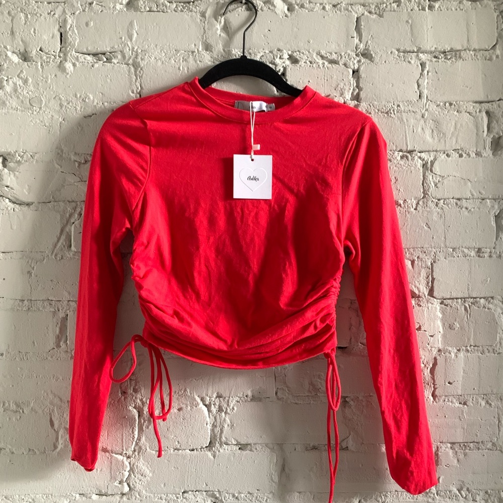Red longsleeve top with ties